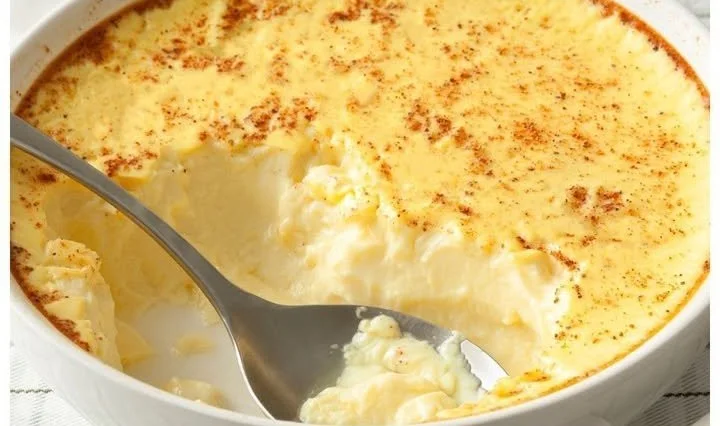 Delicious baked custard dessert served in a ramekin, garnished with nutmeg.