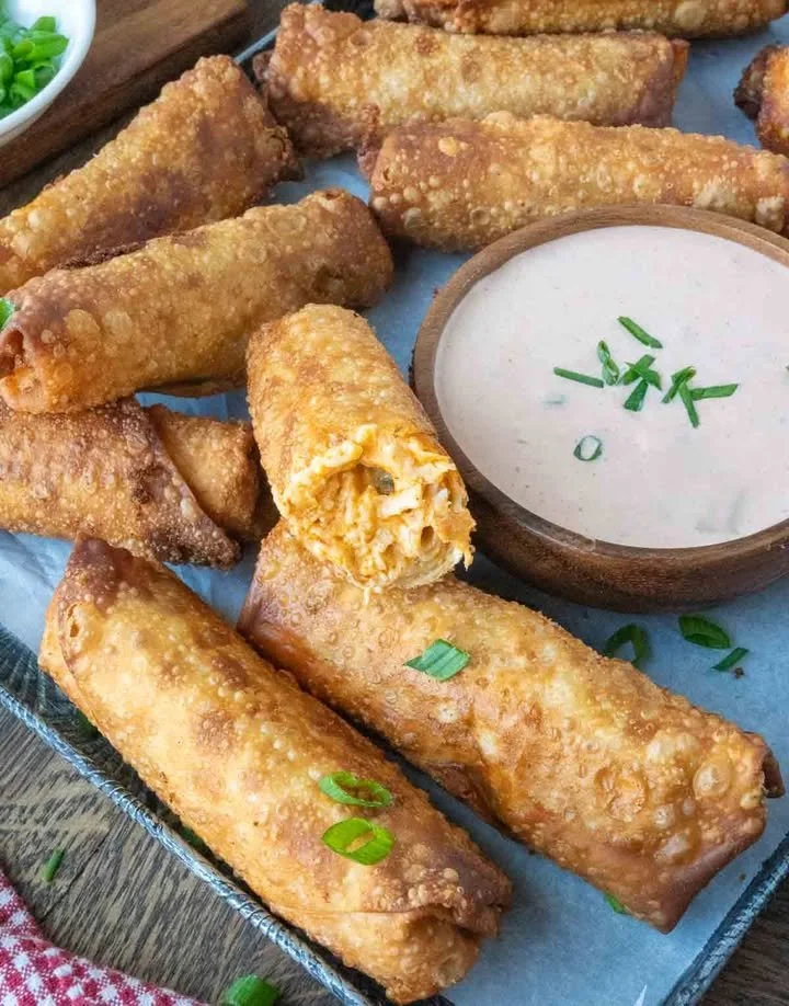 Delicious Buffalo Chicken Egg Rolls served with dipping sauce