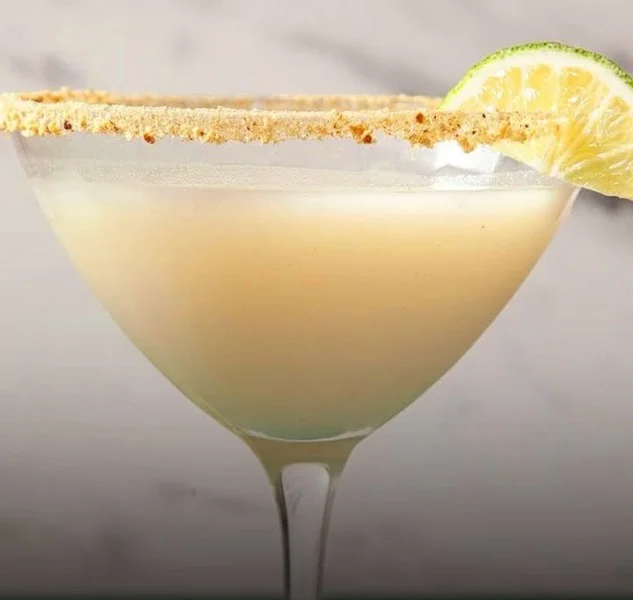 Refreshing Key Lime Martini garnished with a lime slice