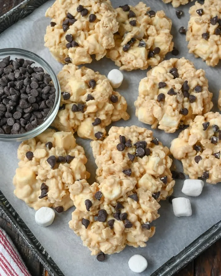 Plate of no bake avalanche cookies with chocolate and marshmallows on a rustic table