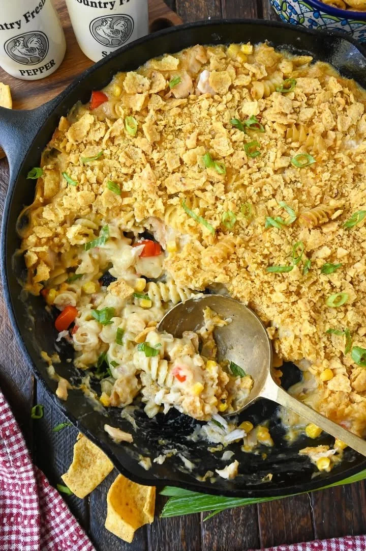 Tex Mex Chicken Casserole topped with cheese and fresh ingredients